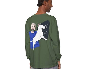 May include: A green long-sleeve t-shirt with a cartoon illustration of a man and a white bull terrier dog on the back. The dog is jumping up and the man is wearing a blue shirt.