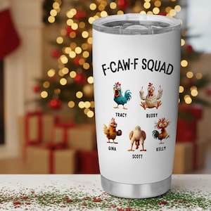 May include: A white stainless steel tumbler with a black lid. The tumbler features the text "F-CAW-F SQUAD" above cartoon chicken illustrations. Each chicken has a name: Tracy, Buddy, Gina, Scott, and Kelly. The background is blurred with Christmas lights.