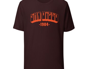 Camiseta con letras mayúsculas de color naranja de San Diego 1904
