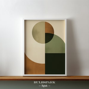 May include: Abstract geometric art print with a white frame. The print features a large circle with a smaller circle inside, both in shades of green and brown. The background is a light beige color.