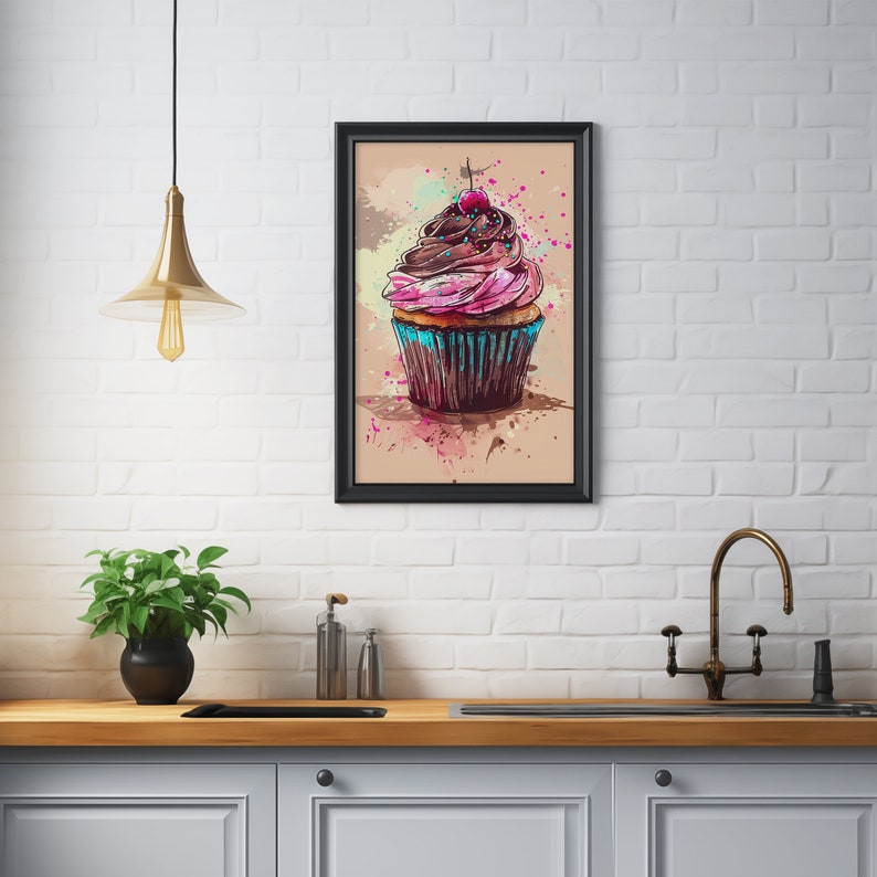 May include: A watercolour painting of a pink and brown cupcake with a cherry on top. The cupcake is surrounded by colourful paint splatters on a beige background.