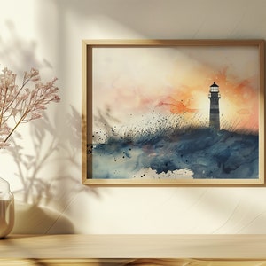 Puede incluir: Una pintura de acuarela de un faro en una costa rocosa al atardecer. El cielo es una mezcla de naranja, rosa y azul, y el agua es de un azul profundo. El faro est&aacute; silueteado contra el cielo.