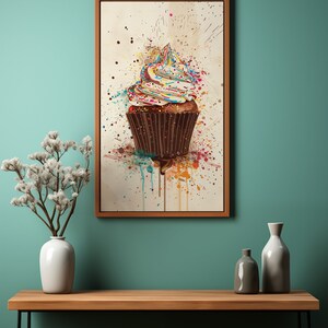 May include: A colourful cupcake with sprinkles on top, painted in a watercolour style with splatters of paint.