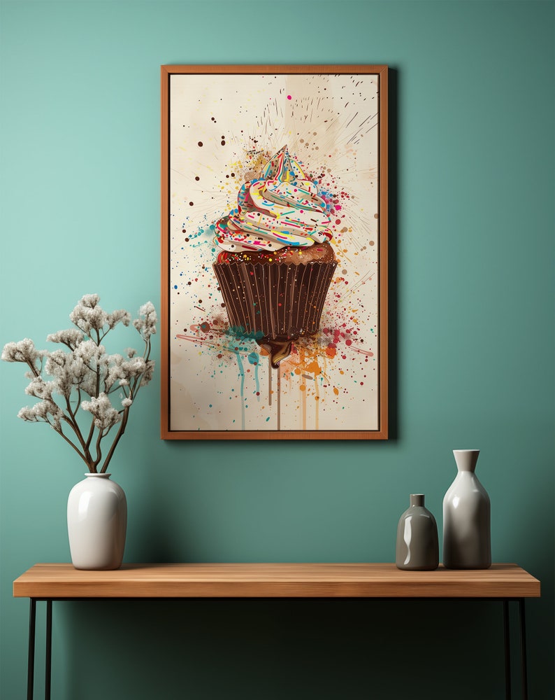 May include: A colourful cupcake with sprinkles on top, painted in a watercolour style with splatters of paint.