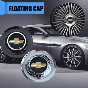 Könnte beinhalten: Drei verschiedene Radkappen mit einem goldenen Chevrolet-Logo. Die Radkappen sind schwarz, verchromt und silberfarben mit schwarzen Speichen.