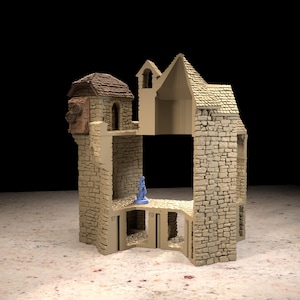Puede incluir: Una estructura de edificio en miniatura de piedra beige con techo texturizado, puertas arqueadas y un interior hueco. Una pequeña figura azul se encuentra en el nivel central. Las paredes exteriores muestran un patrón de mampostería detallado.