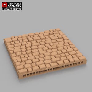 Puede incluir: Una pieza de terreno rectangular de color beige con un diseño de adoquines. La pieza presenta una base en forma de rejilla y está formada por numerosos bloques de forma irregular. La esquina superior izquierda muestra el texto "PRINTABLE SCENERY LICENSED PRINTER."