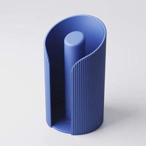 May include: A modern, blue paper towel holder. The holder has a cylindrical shape with vertical ribbed detailing and a central post. The design features a curved top and base, creating a sleek, minimalist aesthetic.