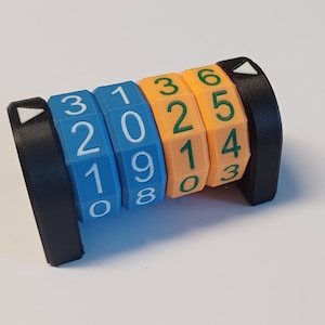 May include: A blue and orange counter with rotating dials displaying the numbers 3210, 1098, 3210, and 6543.