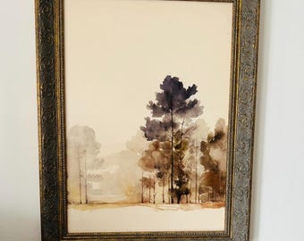 Lámina vintage de acuarela con diseño de bosque enmarcada en tono dorado.