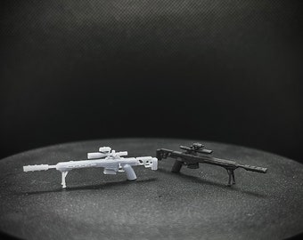 May include: Two miniature toy sniper rifles. One is light gray, the other is black. Both have scopes and bipods. The rifles are on a dark, circular surface against a black background.