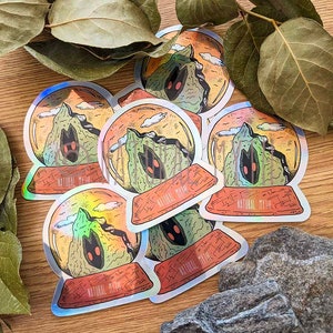 Holographic Haunted Mountain Snow Globe Sticker - Whimsical Art Decal