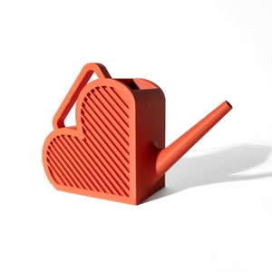 May include: A red heart-shaped watering can with a ribbed texture and a long spout.
