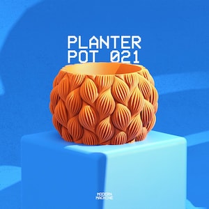 May include: An orange planter pot with a repeating textured pattern of vertical, leaf-like ridges covering the exterior. The text PLANTER POT 021 is displayed in white pixelated font above the object, with MODERN MACHINE at the bottom.