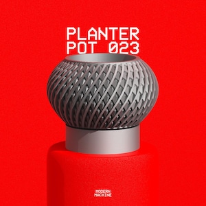 May include: A gray planter pot with a textured, repeating geometric pattern on its rounded exterior. The text PLANTER POT 023 is displayed above the object, and the text MODERN MACHINE is visible at the bottom against a solid red background.