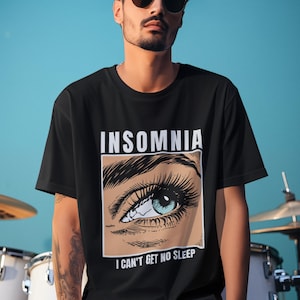 May include: A black t-shirt featuring a graphic of a large eye with the text "INSOMNIA I CAN'T GET NO SLEEP".