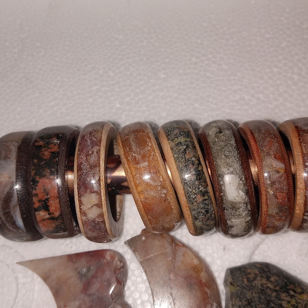 Custom wood with stone inlay rings. Black pudding  stone white pudding stone  crazy lace agate petoskey stones and more