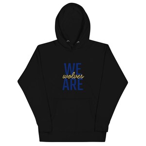 May include: Black hooded sweatshirt with the text "WE wolves ARE" in blue and gold lettering.