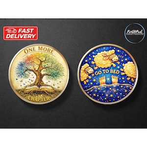 May include: Two round decorative items. One features a colorful tree with the text "ONE MORE CHAPTER". The other has three sheep, the text "GO TO BED", and a starry night sky design.