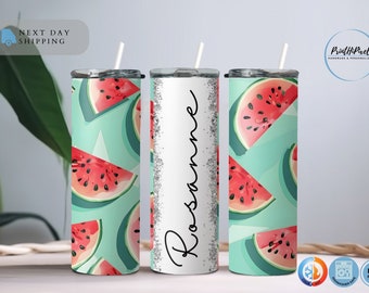 May include: Three stainless steel tumblers with a watermelon pattern. The tumbler in the middle has the name "Rosanne" written on it in silver glitter.