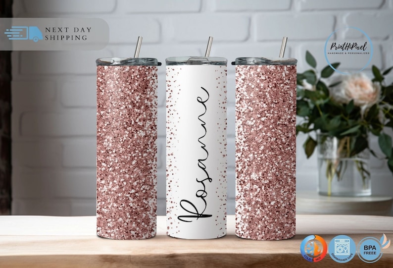 May include: Three stainless steel tumblers with rose gold glitter. The center tumbler has the name "Rosanne" written in black script.