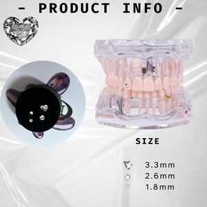 May include: A set of tooth gems in various sizes, including a heart shape, round, and small round. The gems are shown on a black background and on a model of a human mouth. The sizes are listed as 3.3 mm, 2.6 mm, and 1.8 mm.