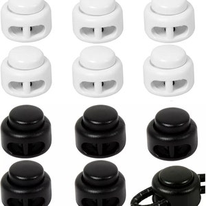 May include: Twelve plastic toggle cord locks, six white and six black. The cord locks have two holes for threading cords through.