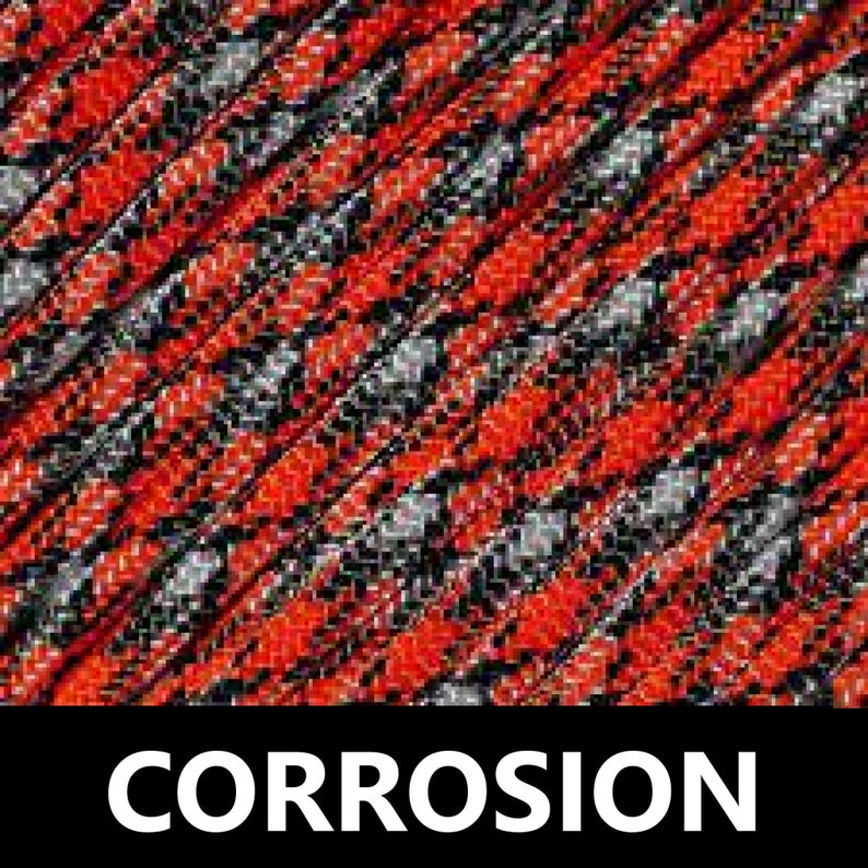 May include: A close-up of a red, black and grey patterned fabric with the word "CORROSION" printed in white.