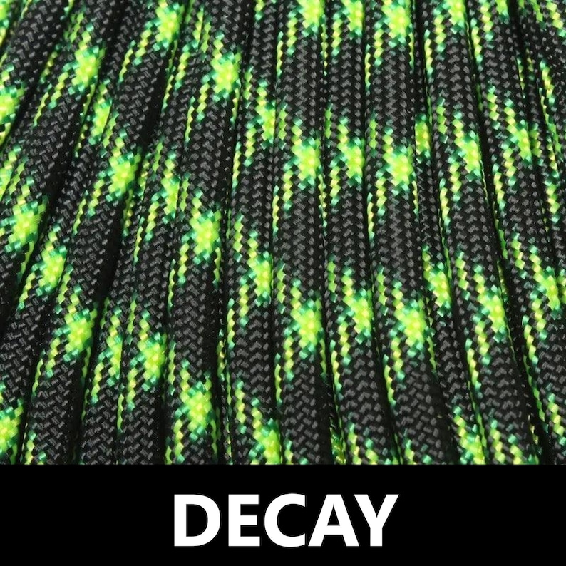 May include: Close-up of black and green paracord with a repeating diamond pattern. The paracord is labelled "DECAY".