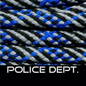 May include: Blue, black and silver braided rope with the text "POLICE DEPT." printed on a black background.
