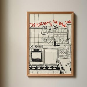 May include: A black and white line drawing of a kitchen with the text "This kitchen is for dancing" written above the stove. The kitchen features a stove, oven, cabinets, and a shelf with various kitchen items.