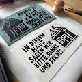 IN THIS HOUSE we say... - Hand-printed linocut on a right-wing extremist book page, A5 size product logo