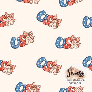 May include: A repeating pattern featuring the word "USA" in red, white, and blue. The letters are stylized with a mix of stripes, stars, and bows, creating a patriotic design. The background is a soft, off-white color.