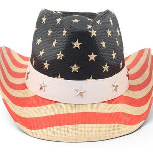 May include: A patriotic cowboy hat with a black crown adorned with gold stars. The brim features red and white stripes, and a white band with silver star accents. This hat is perfect for Independence Day celebrations.