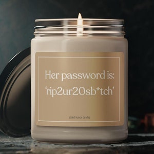 May include: A beige candle in a glass jar with a gold label that reads "Her password is: 'rip2ur20sb*tch'" and "added humor candles".