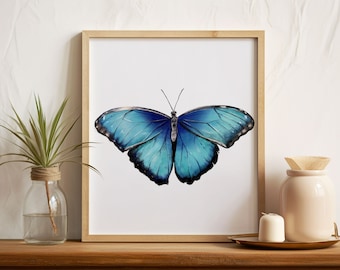 May include: A framed print of a blue morpho butterfly with its wings spread wide. The butterfly is depicted in a watercolor style, with shades of blue and black.