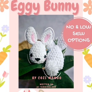 May include: A crochet pattern for a white bunny with pink ears, called "Shellie the Eggy Bunny". The pattern includes no-sew and low-sew options and is written in US terminology.  The pattern is by Cozi Mango.