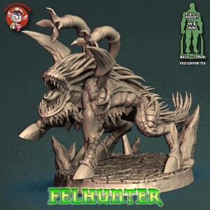 May include: A detailed 3D printed miniature of a monstrous creature with a long, sharp tongue, multiple limbs, and a spiky tail. The creature is standing on a rocky base and is labeled "FELHUNTER". The miniature is 4.46 inches tall and has a 2-inch base.