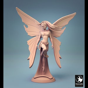 May include: A detailed figurine of a fairy with wings outstretched, standing on a base. The fairy is sculpted in a nude pose with flowing hair and intricate details on her wings and clothing.