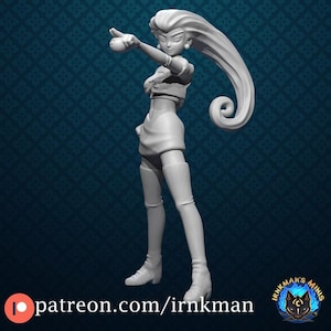 May include: A 3D-printed figurine of a female character in a dynamic pose, with long, flowing hair. The figure is wearing a short skirt, boots, and a crop top. The figurine is light gray and stands on a patterned blue surface. The text "patreon.com/irnkman" is visible.