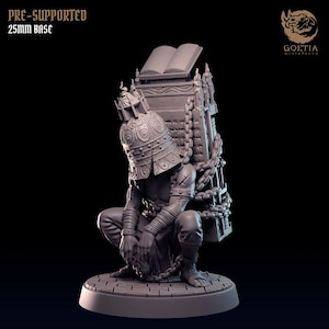 May include: A gray miniature figure of a kneeling person wearing a helmet and carrying a chained structure with an open book on top. The figure is on a 25mm base. The text "PRE-SUPPORTED" and "25mm BASE" is visible.