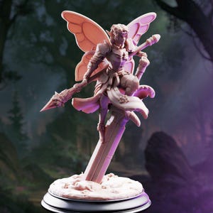 May include: A light-coloured miniature figurine of a fairy warrior with pointed ears and large wings, wearing ornate armour and a flowing garment. The figure holds a long spear and is perched atop a vertical stone pillar set on a circular base.