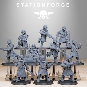 May include: A set of nine gray plastic miniature figures of soldiers wearing gas masks and holding weapons. The figures are posed in various action stances and are arranged on a series of platforms. The figures are part of a wargaming set.