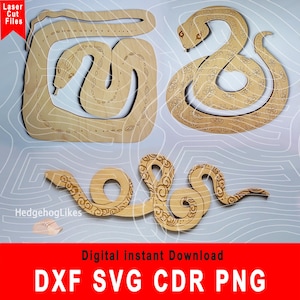 Może przedstawiać: Trzy laserowo wycięte drewniane wzory węży. Węże są bogato zdobione wzorami kwiatowymi. Wzory są dostępne do natychmiastowego pobrania w formatach DXF, SVG, CDR i PNG.