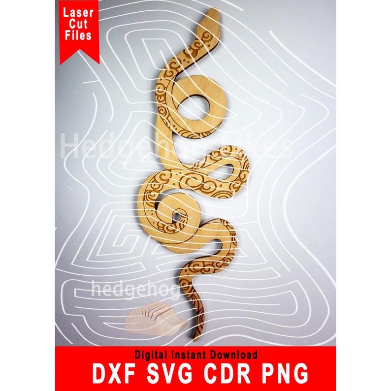 May include: A laser cut file of a snake with a decorative pattern. The file is available in DXF, SVG, CDR, and PNG formats.