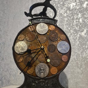 A truly unique clock, handmade from recycled materials, a shop's scale and a selection of coins. My first invention!
