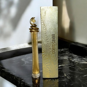 Roberto Cavalli ORO Eau Parfum 75ml. Feminine with a unique edge - accented by a hint of apricot. Discontinued.