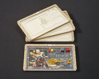May include: A wooden game organizer with a clear acrylic insert for storing game pieces. The organizer has a floral design and the text "The Black" is visible. The organizer is designed for a board game.