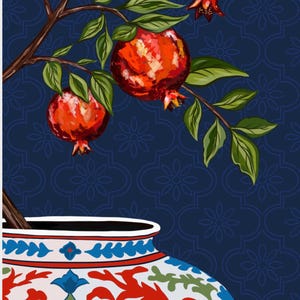 May include: A decorative ceramic vase with a white base and intricate red, blue, and green floral patterns. A brown tree branch emerges from the top, featuring vibrant red pomegranates and green leaves against a dark blue background.