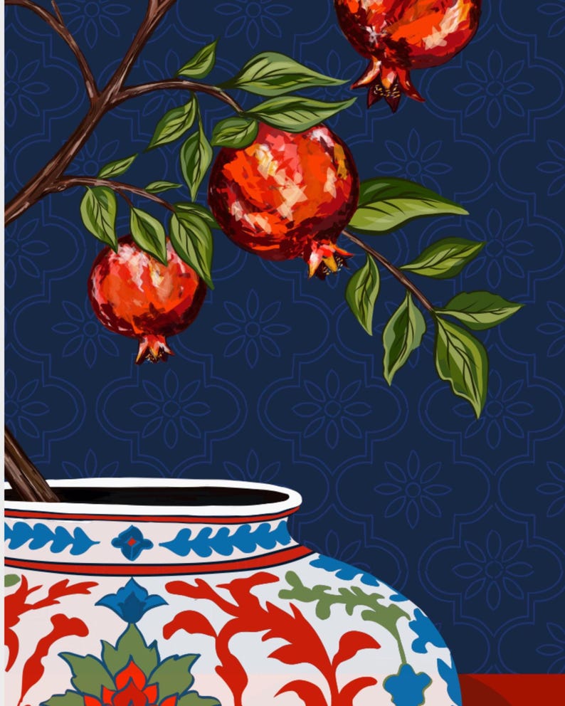 May include: A decorative ceramic vase with a white base and intricate red, blue, and green floral patterns. A brown tree branch emerges from the top, featuring vibrant red pomegranates and green leaves against a dark blue background.